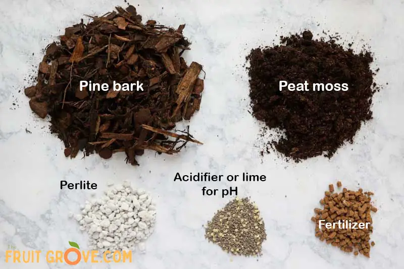 Image of small piles of pine bark, peat moss, perlite, soil acidifier, and fertilizer.